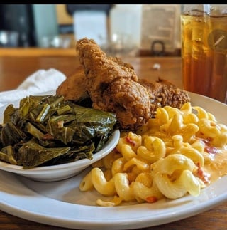 Pan-fried chicken platter with collard greens and mac and cheese at Southern Fresh in Safety Harbor, Florida